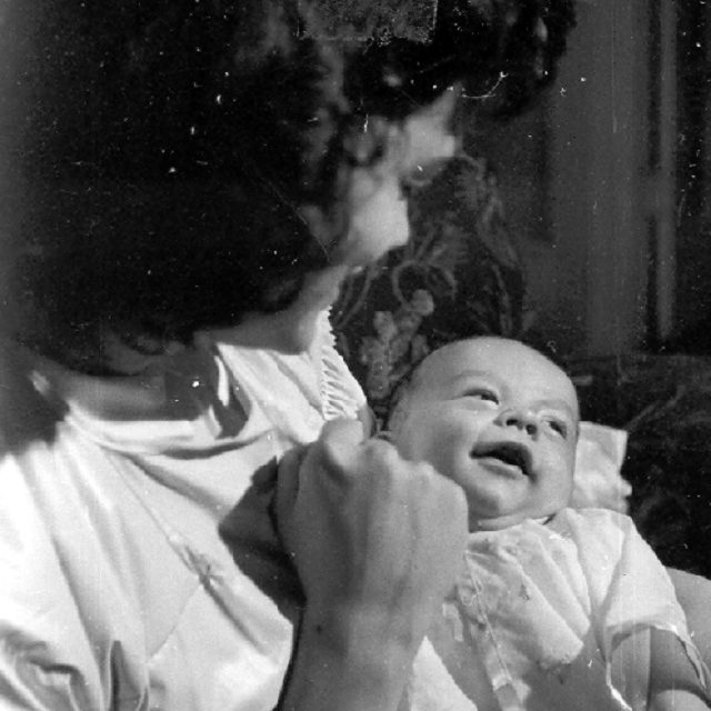 Mary Johnson Windsor holds smiling Billy in 1948