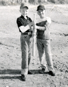 Billy Windsor and Tony Windsor hold baseball bat