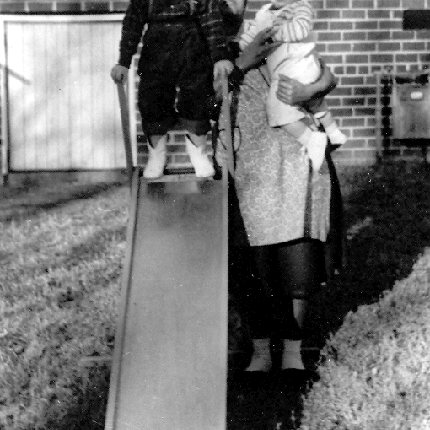 Billy Windsor on slide with maid at 2222 Buena Vista Road in Columbus Georgia