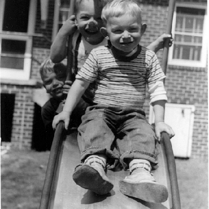 Uncle Steve Johnson with Billy Windsor on slide in backyard in Columbus Georgia